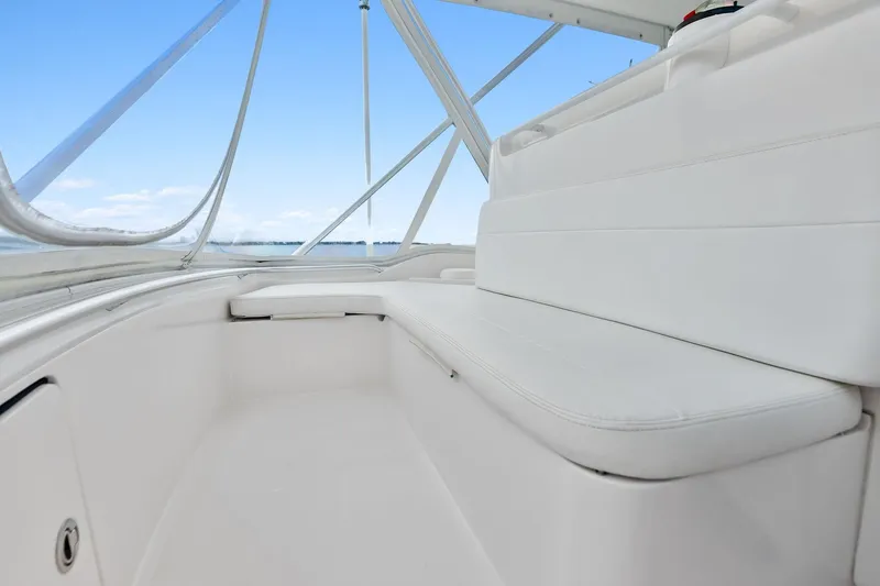Mr. Bond Yacht Photos Pics 2006 Bertram 39 Convertible boat interior with white seating and clear sky view.