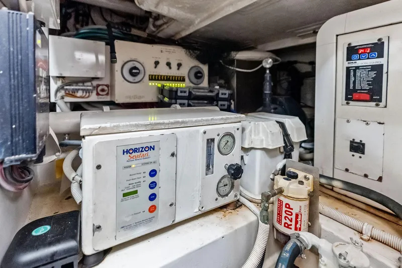 Mr. Bond Yacht Photos Pics Engine room of 2006 Bertram 39 Convertible with Horizon Seafari system and control panels.