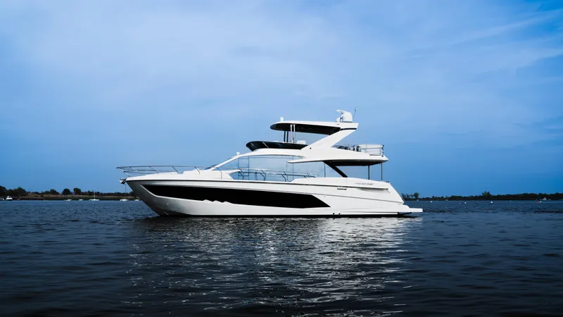  Yacht Photos Pics Luxury Absolute 62 Fly yacht cruising on calm waters, 2022 model.
