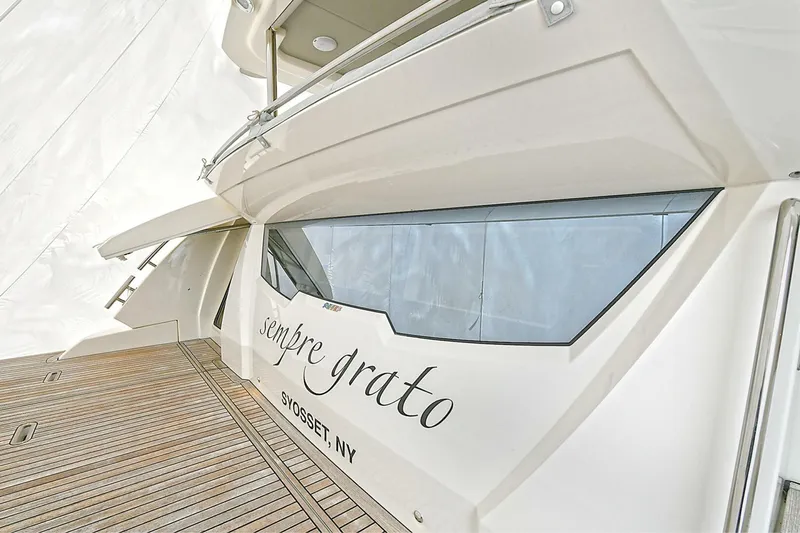  Yacht Photos Pics 2022 Absolute 62 Fly yacht with wooden deck and "sempre grato" inscription.