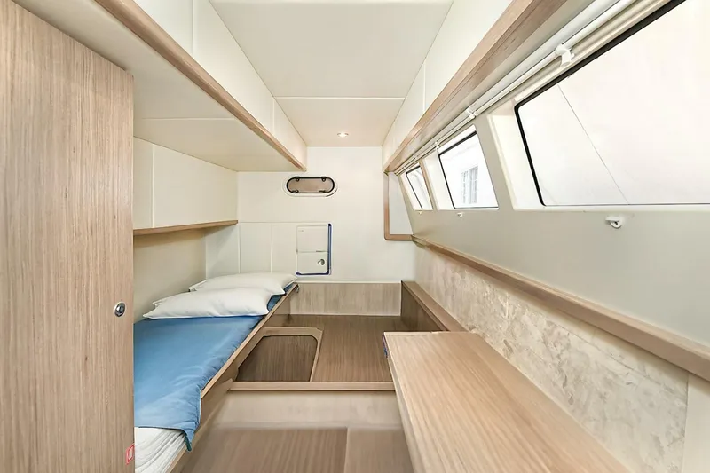  Yacht Photos Pics 2022 Absolute 62 Fly yacht cabin with modern wood interior and large windows.