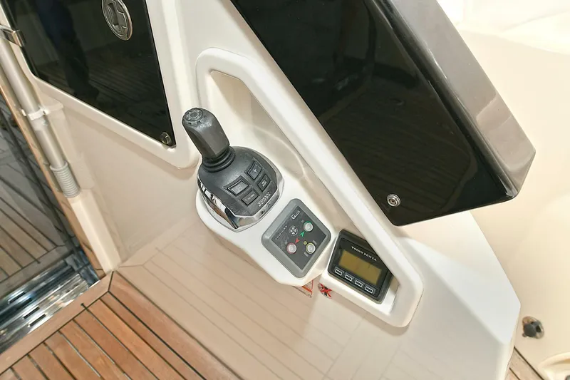  Yacht Photos Pics Control panel of 2022 Absolute 62 Fly yacht with joystick and digital display.