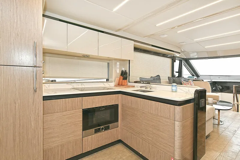  Yacht Photos Pics Luxurious kitchen interior of 2022 Absolute 62 Fly yacht with modern design and amenities.