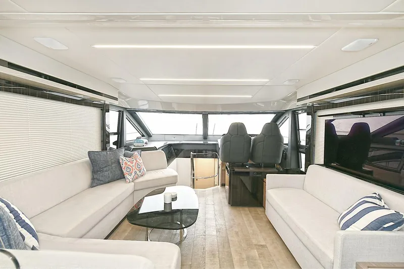  Yacht Photos Pics Luxurious interior of 2022 Absolute 62 Fly yacht with modern seating and elegant decor.