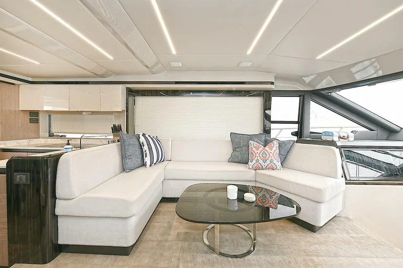  Yacht Photos Pics Luxurious interior of 2022 Absolute 62 Fly yacht with modern seating and elegant decor.