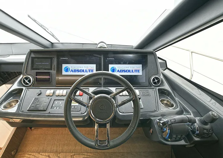  Yacht Photos Pics Cockpit of 2022 Absolute 62 Fly yacht with modern navigation controls and dual screens.