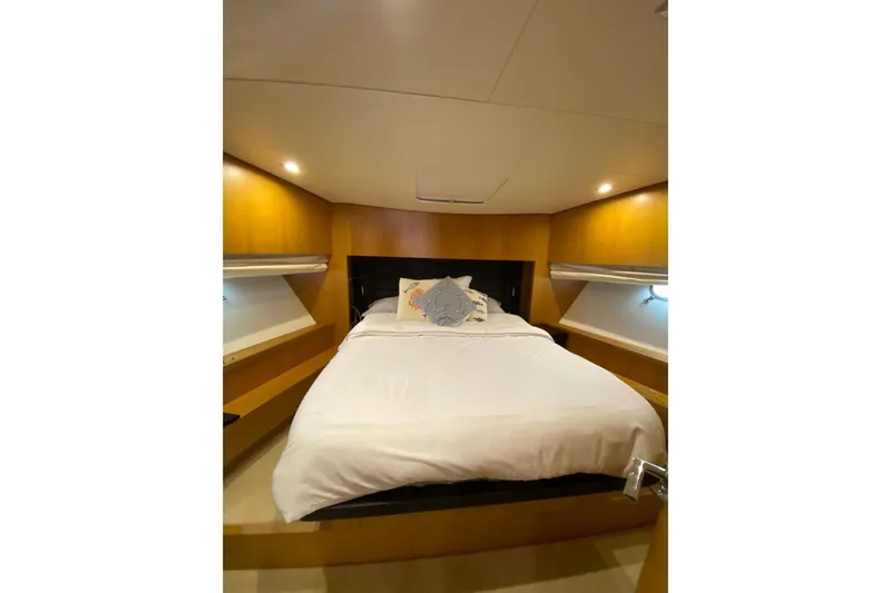  Yacht Photos Pics Luxurious bedroom interior of 2011 Sanlorenzo SL62 yacht with cozy bed and ambient lighting.