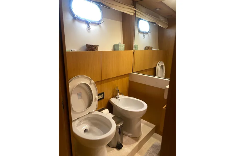  Yacht Photos Pics Bathroom interior of 2011 Sanlorenzo SL62 yacht with toilet and bidet.