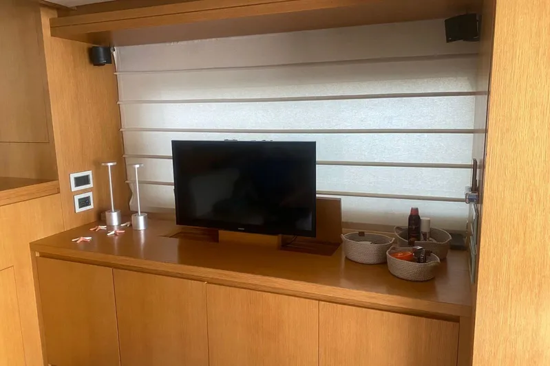  Yacht Photos Pics Interior of 2011 Sanlorenzo SL62 yacht with TV and storage baskets.