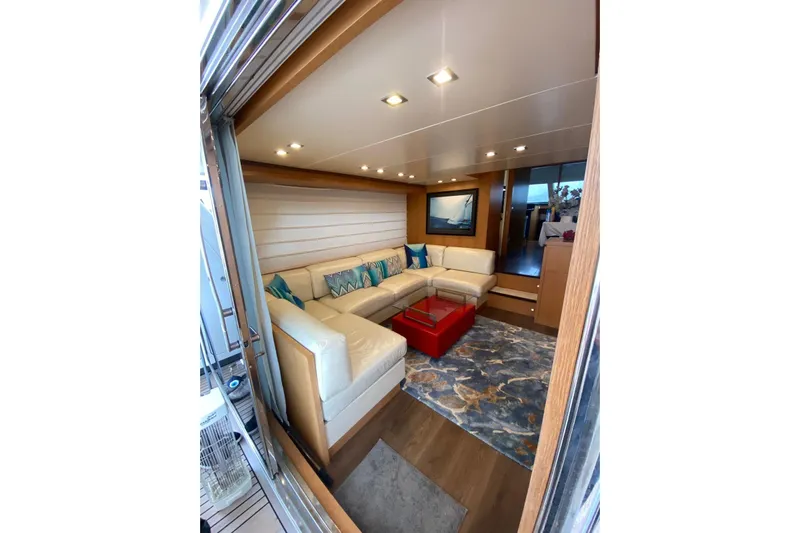  Yacht Photos Pics Luxurious interior of 2011 Sanlorenzo SL62 yacht with elegant seating and modern decor.