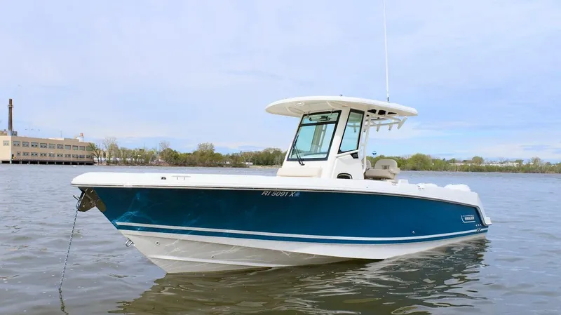 Best Opportunity Yacht Photos Pics 2017 Boston Whaler 280 Outrage boat on calm water with a blue hull.