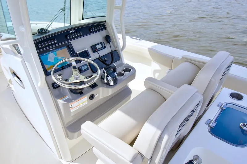Best Opportunity Yacht Photos Pics 2017 Boston Whaler 280 Outrage boat cockpit with steering wheel and navigation controls.