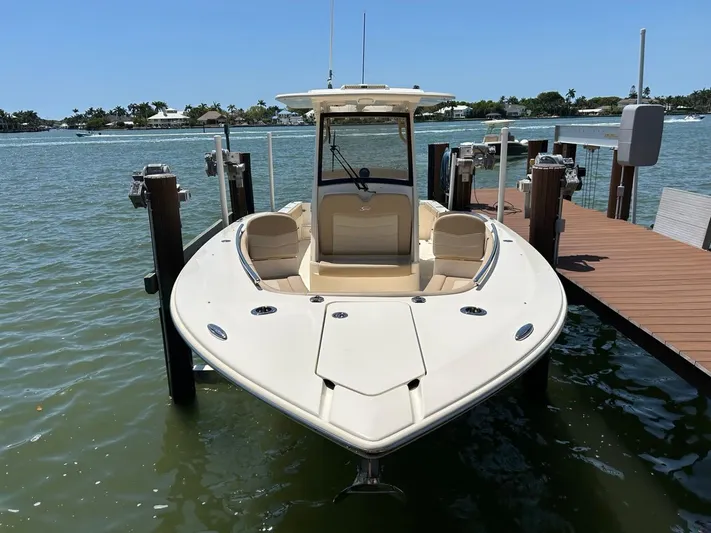  Yacht Photos Pics 2023 Scout 277 LXF boat docked on a sunny day.