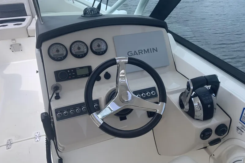  Yacht Photos Pics Cockpit of 2019 Boston Whaler 270 Vantage with Garmin navigation system and steering wheel.