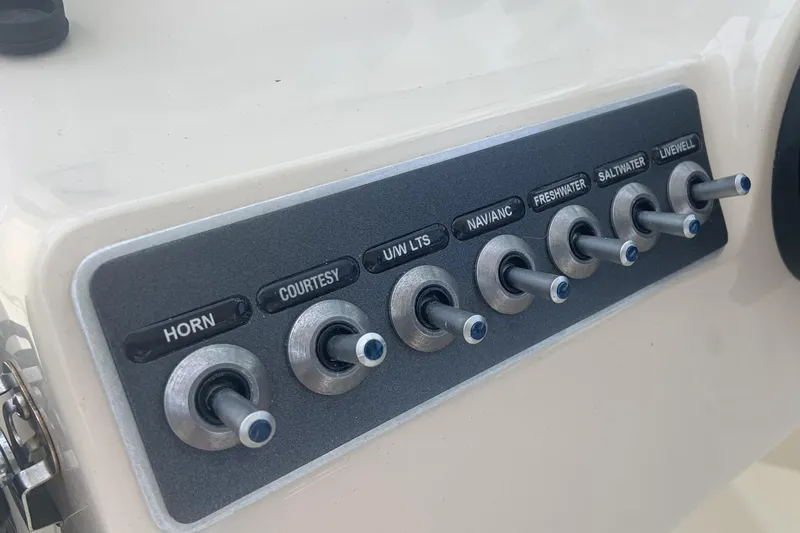  Yacht Photos Pics Control panel of a 2019 Boston Whaler 270 Vantage boat with labeled switches.