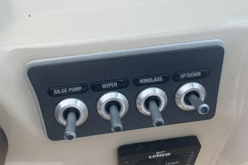  Yacht Photos Pics Control panel of a 2019 Boston Whaler 270 Vantage boat with labeled switches.
