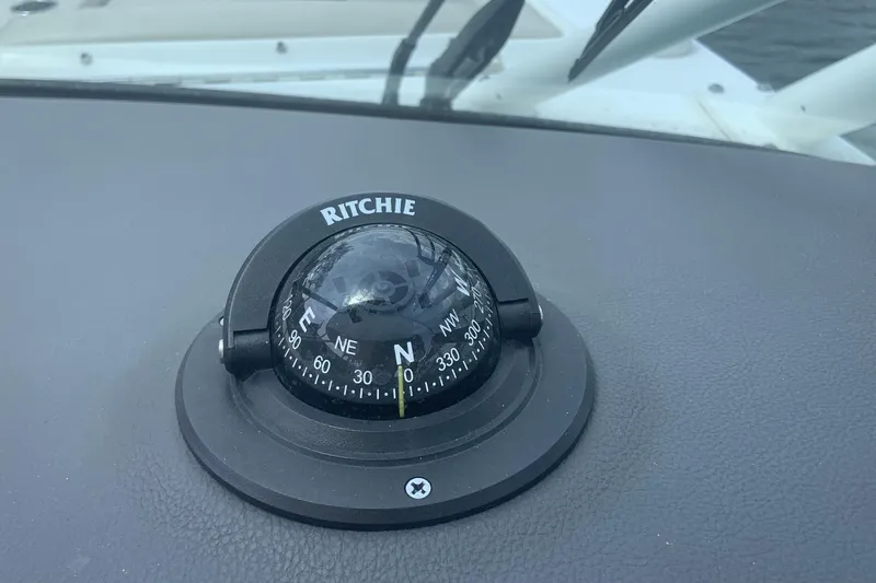  Yacht Photos Pics Ritchie compass on 2019 Boston Whaler 270 Vantage dashboard, showing north direction.