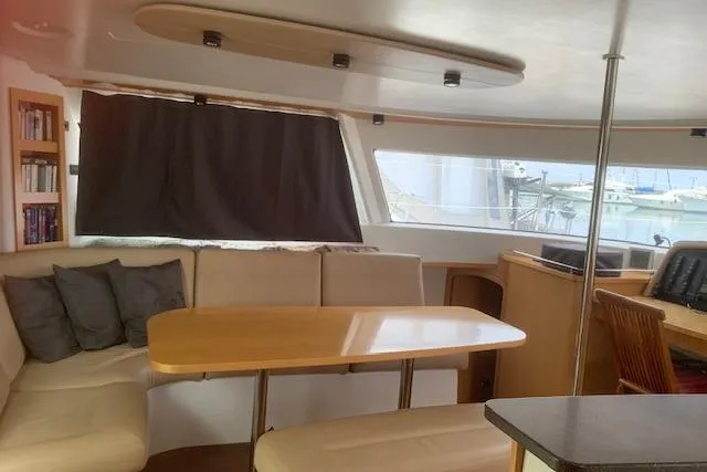  Yacht Photos Pics Interior of 2008 Fountaine Pajot Salina 48 catamaran with dining area and windows.