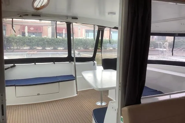  Yacht Photos Pics 2008 Fountaine Pajot Salina 48 catamaran interior with seating and table.