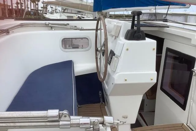  Yacht Photos Pics 2008 Fountaine Pajot Salina 48 yacht cockpit with steering wheel and blue seating.