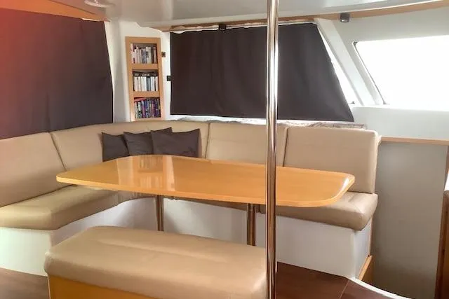  Yacht Photos Pics Interior of 2008 Fountaine Pajot Salina 48 catamaran with cozy seating and dining area.