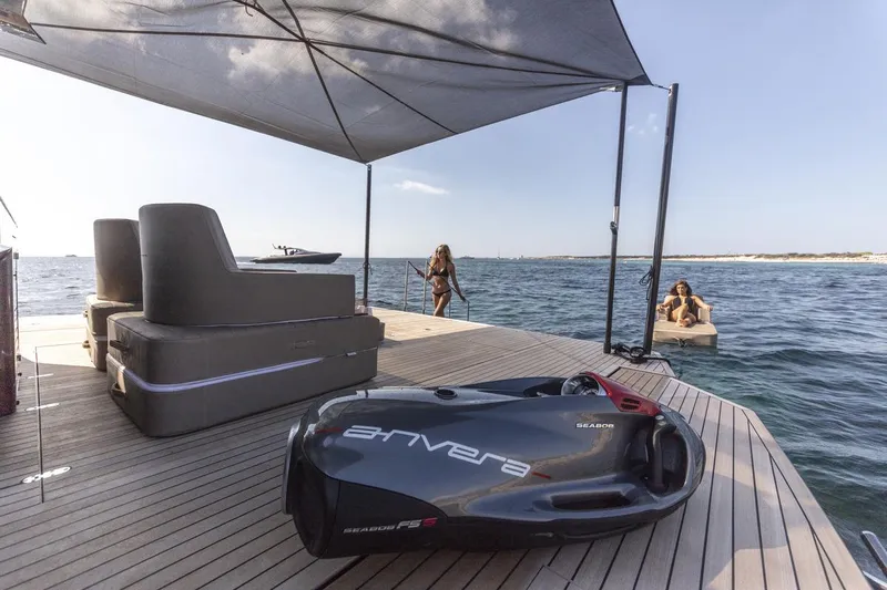 Anvera 48 Yacht Photos Pics Luxury Anvera 48 yacht deck with sea view, featuring modern seating and water activities.