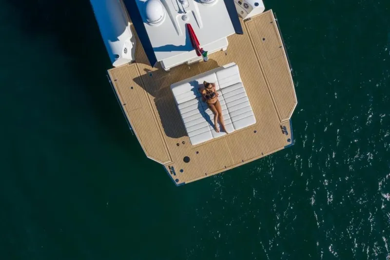 Anvera 48 Yacht Photos Pics Aerial view of a person sunbathing on the deck of a 2025 Anvera 48 yacht.