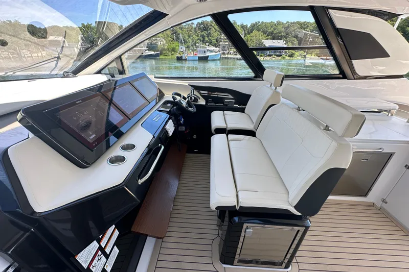  Yacht Photos Pics 2024 Cruisers Yachts 50 GLS helm with modern controls and luxurious seating.