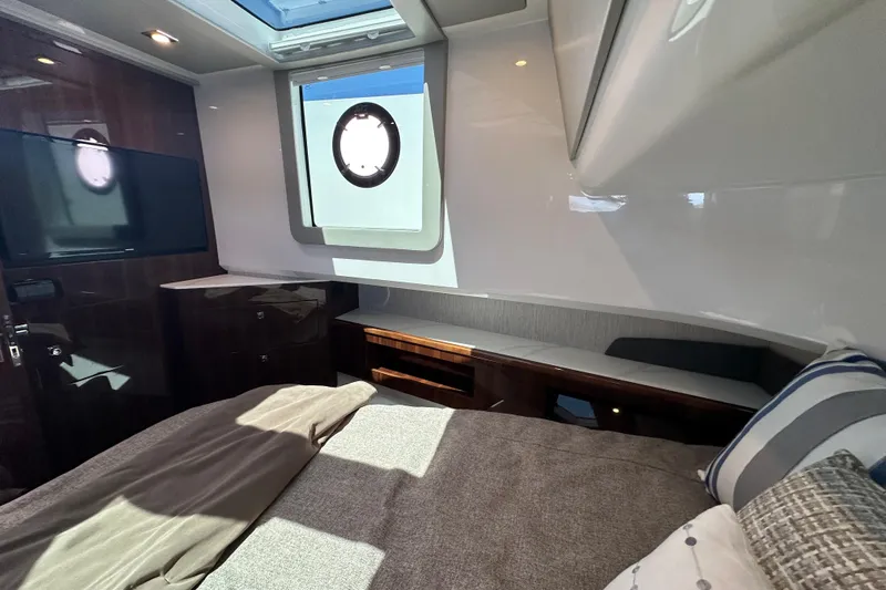  Yacht Photos Pics Luxurious 2024 Cruisers Yachts 50 GLS cabin interior with modern design and natural light.