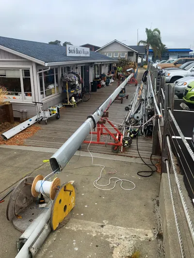 Ayla Yacht Photos Pics Boat mast repair at dockside workshop, featuring Beneteau First 1991 components.