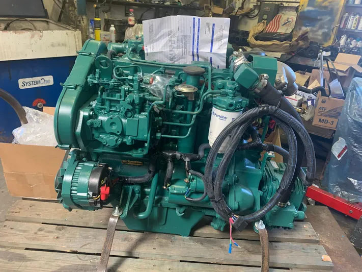 Ayla Yacht Photos Pics Green marine engine on wooden pallet, Beneteau First 1991 model.