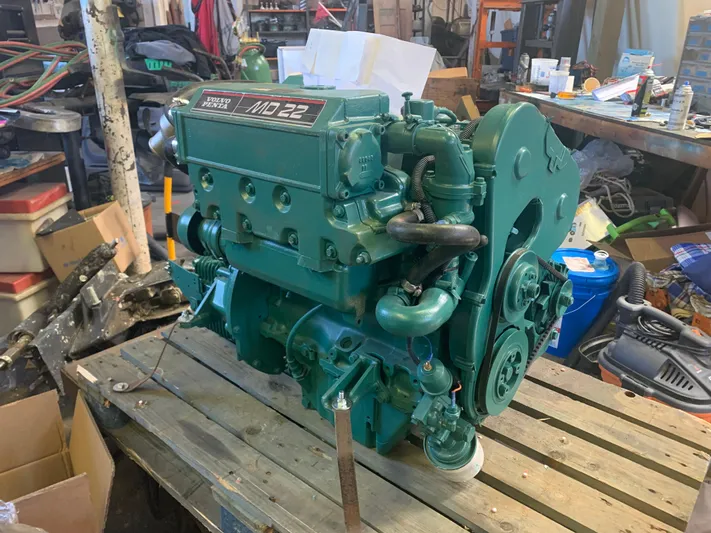 Ayla Yacht Photos Pics Volvo Penta MD22 engine on wooden pallet in workshop, compatible with 1991 Beneteau First.