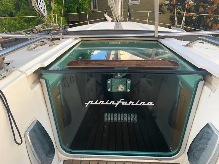 Ayla Yacht Photos Pics 1991 Beneteau First sailboat cockpit with Pininfarina design, featuring sleek glass hatch.