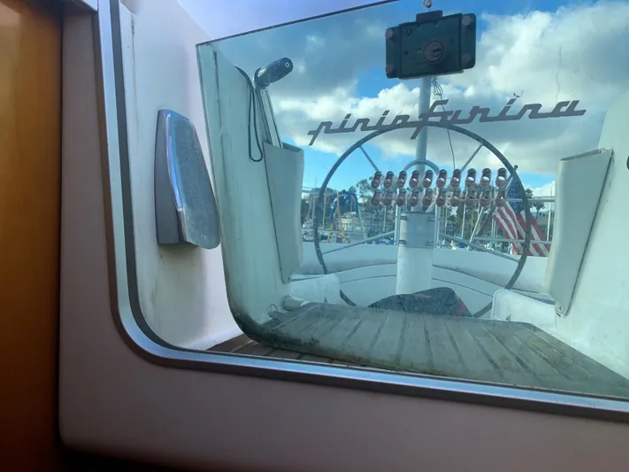 Ayla Yacht Photos Pics 1991 Beneteau First sailboat cockpit view with Pininfarina design, American flag visible.