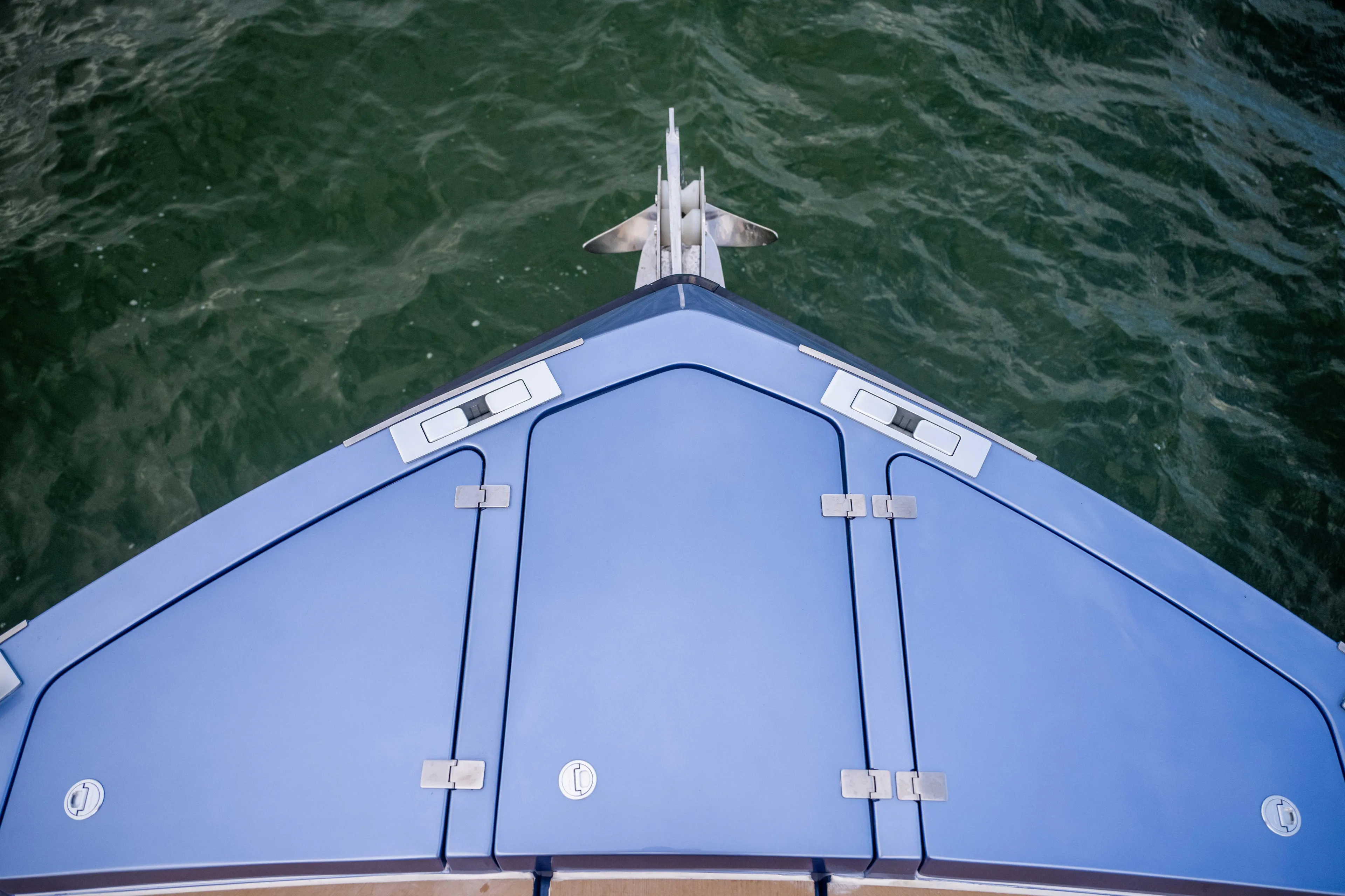  Yacht Photos Pics Bow of 2026 Santasevera52 yacht with sleek blue design on water.