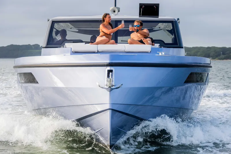  Yacht Photos Pics Luxury Santasevera52 yacht cruising with two people enjoying drinks on deck.