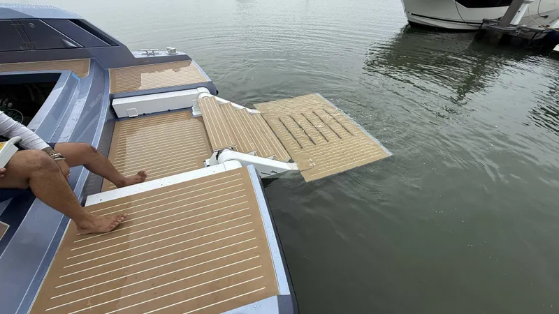  Yacht Photos Pics Luxury yacht Santasevera52 with extended swim platform, 2026 model, docked on calm water.