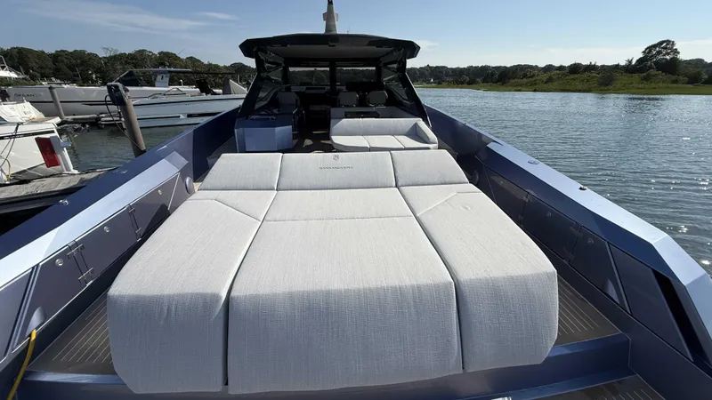  Yacht Photos Pics Luxurious Santasevera52 yacht with spacious sunbed, docked by serene waters, 2026 model.