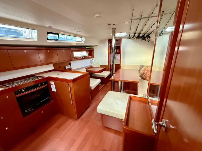 Sol Searcher Yacht Photos Pics Interior of 2013 Beneteau Oceanis 41 yacht with modern kitchen and seating area.
