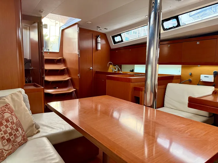 Sol Searcher Yacht Photos Pics Interior of 2013 Beneteau Oceanis 41 sailboat with wooden furnishings and modern design.