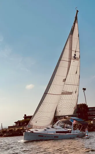 Sol Searcher Yacht Photos Pics 2013 Beneteau Oceanis 41 sailboat cruising on open water under clear skies.