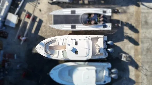  Yacht Photos Pics Aerial view of 2013 Grady-White Freedom 335 boat docked among other vessels.