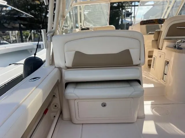  Yacht Photos Pics 2013 Grady-White Freedom 335 boat interior with white seating and storage compartment.