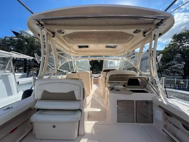  Yacht Photos Pics 2013 Grady-White Freedom 335 boat interior with seating and helm station.