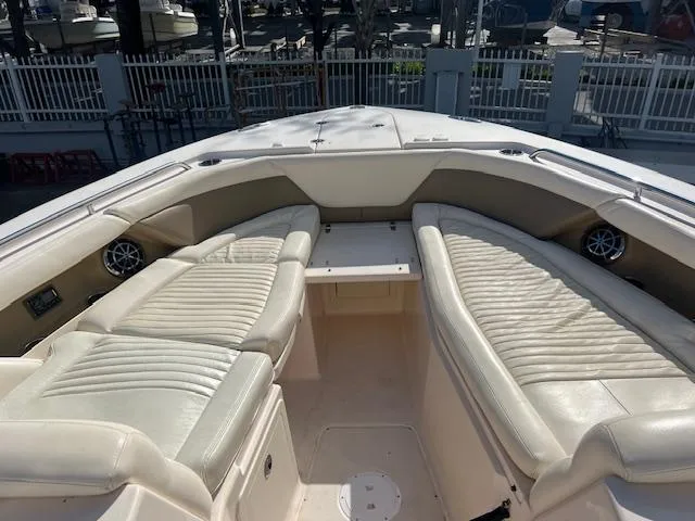  Yacht Photos Pics 2013 Grady-White Freedom 335 boat interior with cushioned seating and speakers.