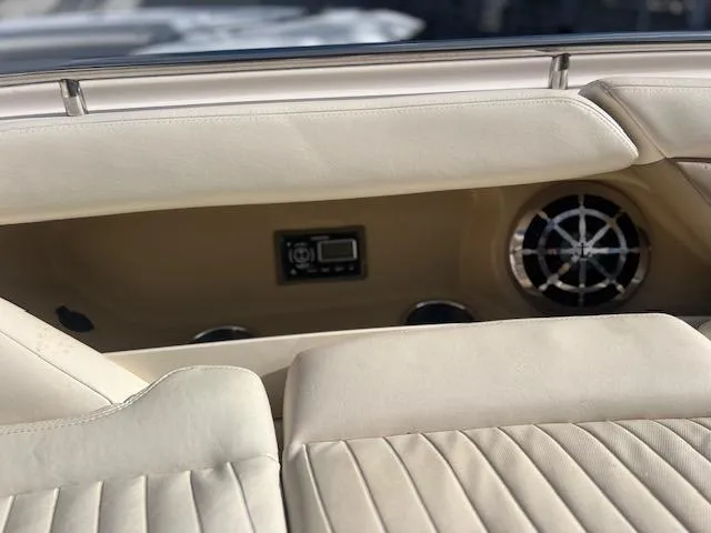  Yacht Photos Pics 2013 Grady-White Freedom 335 boat interior with beige seating and speaker system.