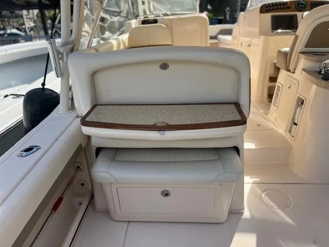  Yacht Photos Pics 2013 Grady-White Freedom 335 boat interior with seating and storage compartments.