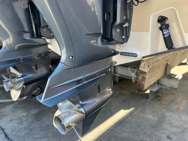  Yacht Photos Pics 2013 Grady-White Freedom 335 boat with dual outboard motors in a marina setting.