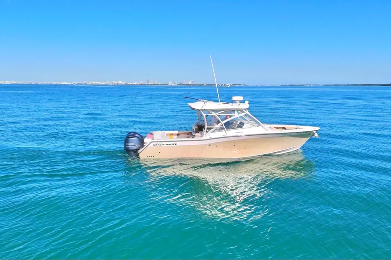  Yacht Photos Pics 2013 Grady-White Freedom 335 boat on calm blue ocean waters.