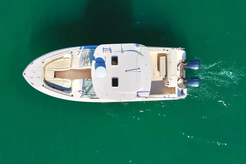  Yacht Photos Pics Aerial view of 2013 Grady-White Freedom 335 boat on clear green water.